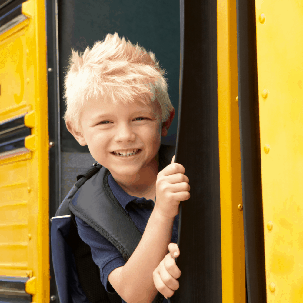 Blonde boy on school bus